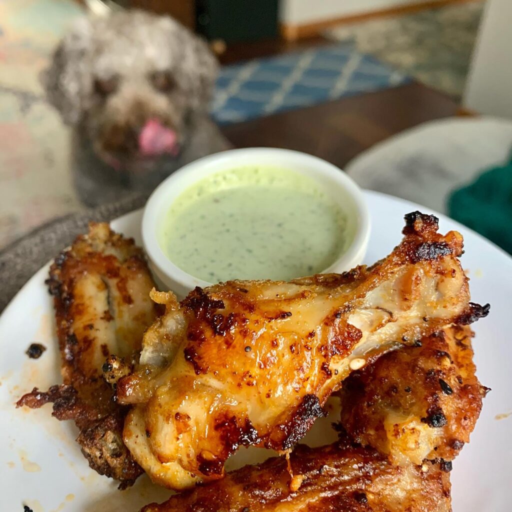 Loving our air fryer! Look at how crispy these little beauties are. I toss the wings in good olive oil, garlic power, season salt, pepper, and onion powder. I cooked for about 12 minutes. I basted the wings twice with hot wing sauce and turned them to get both sides with the sauce. So good! Our pup Penny things so too! Go to www.yumsofresh.com for more healthy recipes. #yumsofresh #wings #airfryerrecipes #spanishwaterdog